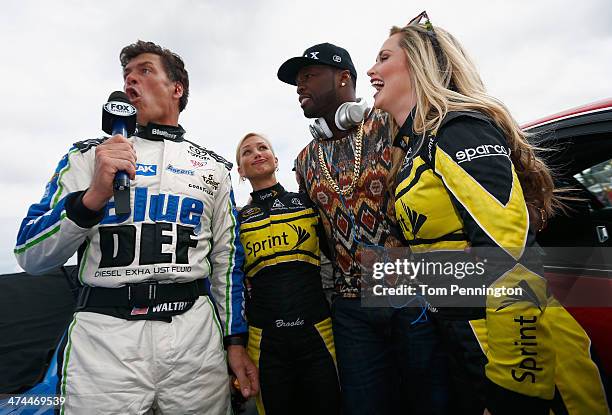 Michael Waltrip , driver of the BlueDEF/AAA Toyota, stands with Curtis '50 Cent' Jackson and Miss Sprints Kim Coon and Brooke Werner during the...