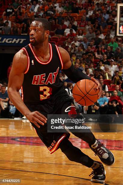 February 23: Dwyane Wade of the Miami Heat dribbles up the court against the Chicago Bulls at the American Airlines Arena in Miami, Florida on Feb....