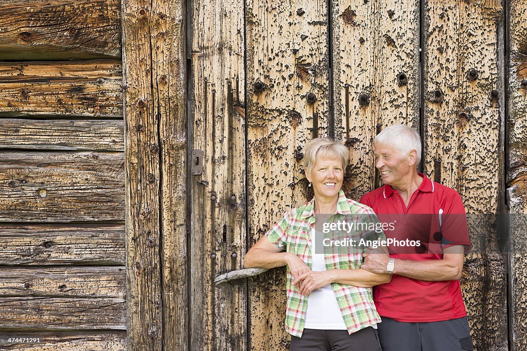 Happy senior couple relaxing in the mountains