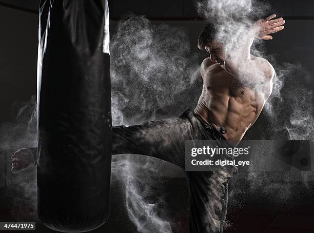 muay thai boxer with powder - belly punching stock pictures, royalty-free photos & images