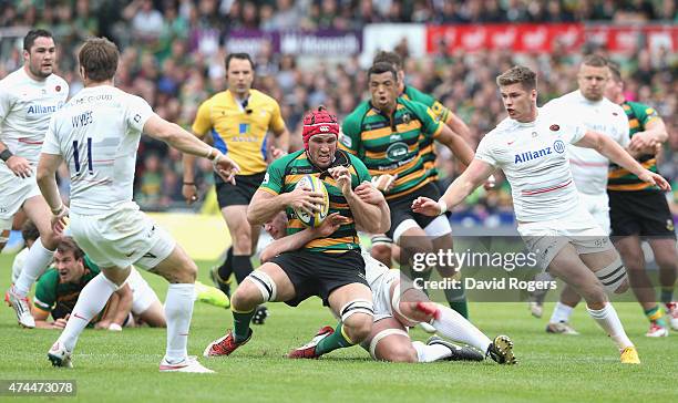 Christian Day of Northampton is tackled during the Aviva Premiership play off semi final match between Northampton Saints and Saracens at Franklin's...