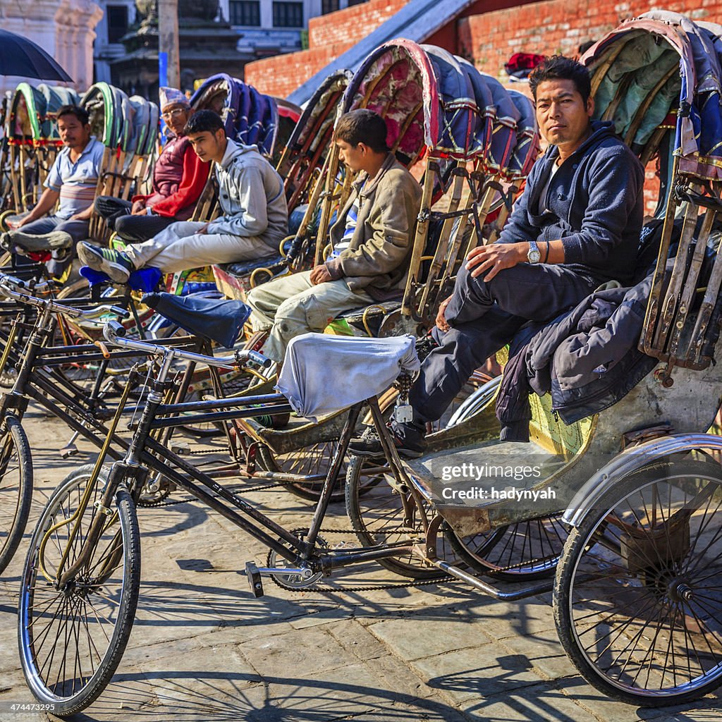 Nepalese rickshaws waiting for tourists on Durbar Square in Kathmandu