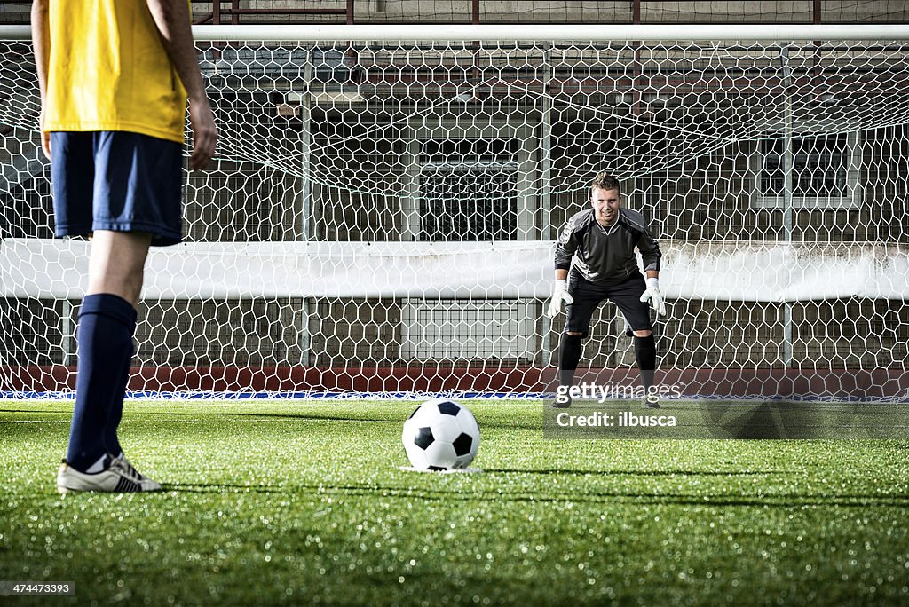 Football match in stadium: Penalty kick