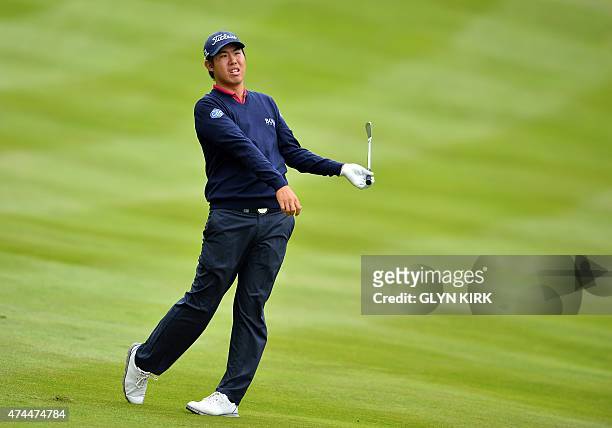 Korean golfer Byeong Hun An watches his second shot to the 4th green on the third day of the PGA Championship at Wentworth Golf Club in Surrey, south...
