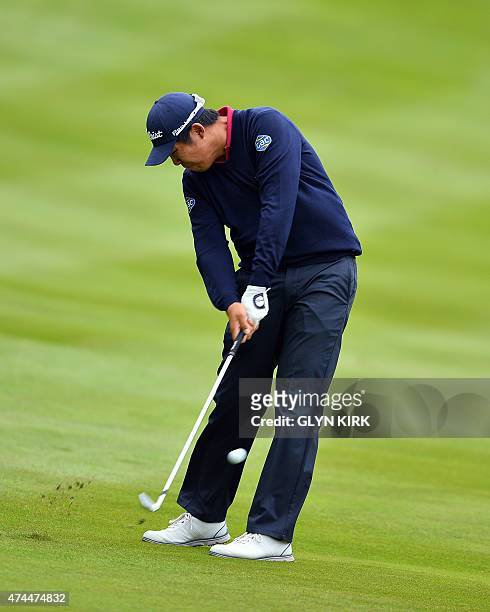 Korean golfer Byeong Hun An plays his second shot to the 4th green on the third day of the PGA Championship at Wentworth Golf Club in Surrey, south...