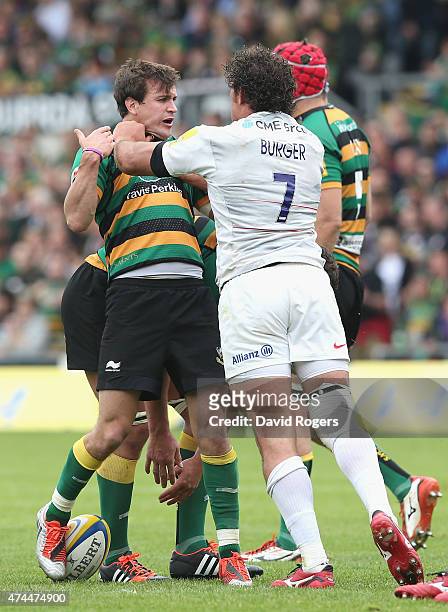 Jacques Burger of Saracens grapples with Lee Dickson during the Aviva Premiership play off semi final match between Northampton Saints and Saracens...