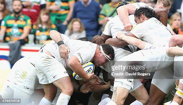 Jamie George of Saracens holds onto the ball as he scores a try during the Aviva Premiership play off semi final match between Northampton Saints and...