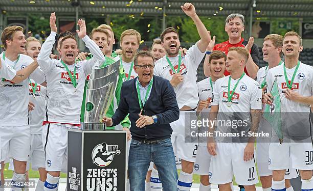 The Bielefelder team celebrates the Third League championship with head coach Norbert Meier after winning the Third League match between...