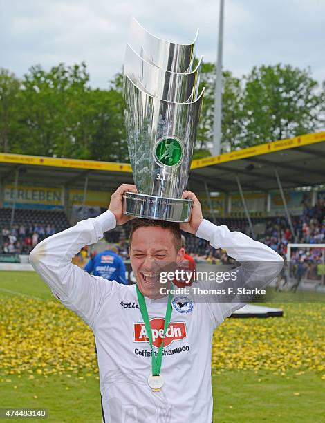 Christian Mueller of Bielefeld celebrates with the cup after the Third League match between Sonnenhof-Grossaspach and Arminia Bielefeld at...