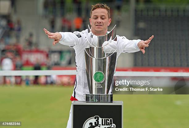 Christian Mueller of Bielefeld celebrates with the cup after the Third League match between Sonnenhof-Grossaspach and Arminia Bielefeld at...