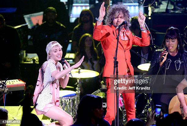 Miley Cyrus and Wayne Coyne perform at Staples Center on February 22, 2014 in Los Angeles, California.