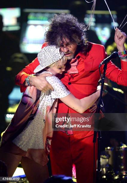 Miley Cyrus and Wayne Coyne perform at Staples Center on February 22, 2014 in Los Angeles, California.