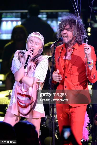 Miley Cyrus and Wayne Coyne perform at Staples Center on February 22, 2014 in Los Angeles, California.