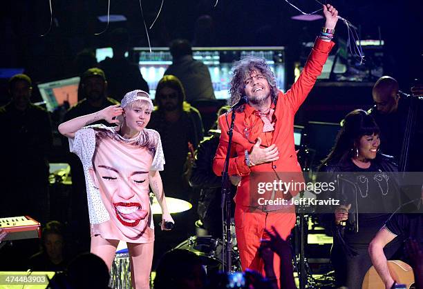 Miley Cyrus and Wayne Coyne perform at Staples Center on February 22, 2014 in Los Angeles, California.