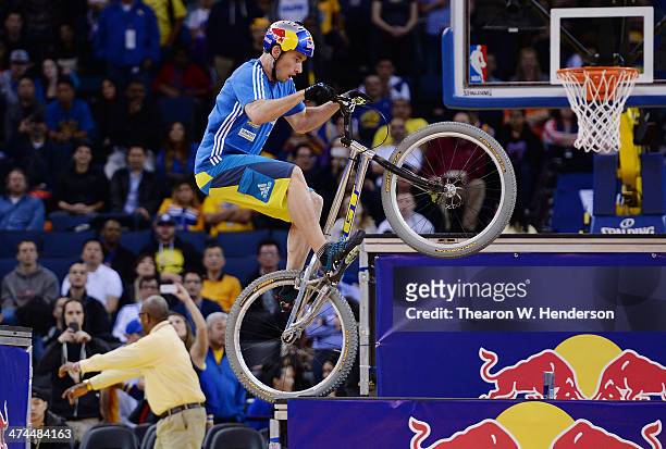 Kenney Belaey nick name "The Magician" and sponsored by Red Bull does bike tricks during half time of an NBA Basketball game between the Houston...