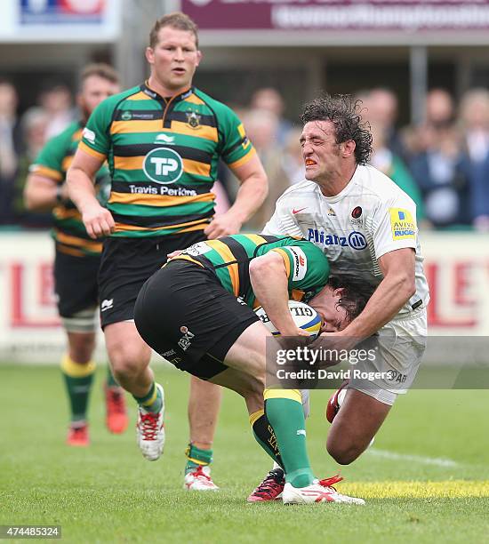 Jacques Burger of Saracens tackles Jamie Elliott during the Aviva Premiership play off semi final match between Northampton Saints and Saracens at...