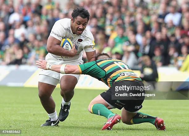 Billy Vunipola of Saracens is tackled by Alex Waller during the Aviva Premiership play off semi final match between Northampton Saints and Saracens...