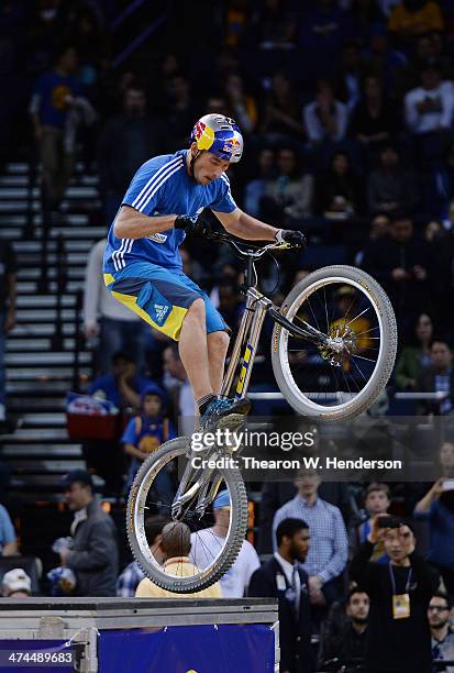 Kenney Belaey nick name "The Magician" and sponsored by Red Bull does bike tricks during half time of an NBA Basketball game between the Houston...