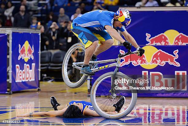 Kenney Belaey nick name "The Magician" and sponsored by Red Bull does bike tricks during half time of an NBA Basketball game between the Houston...