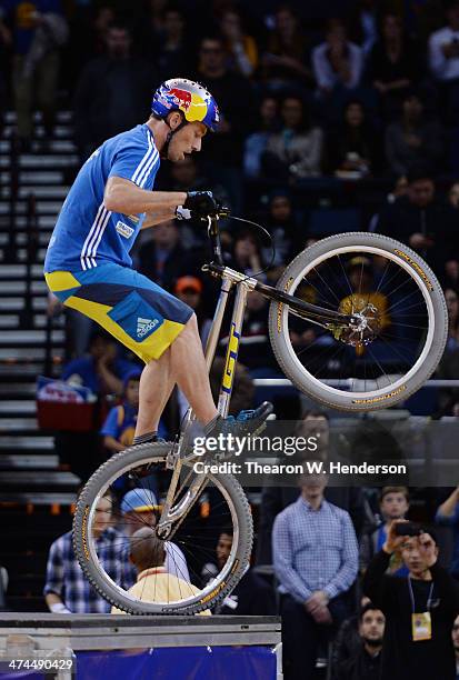 Kenney Belaey nick name "The Magician" and sponsored by Red Bull does bike tricks during half time of an NBA Basketball game between the Houston...