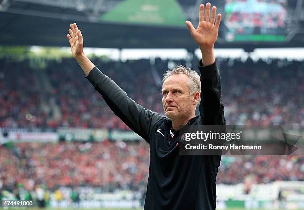 Head coach Christian Streich of Freiburg applauds the fans after the Bundesliga match between Hannover 96 and SC Freiburg at HDI-Arena on May 23,...