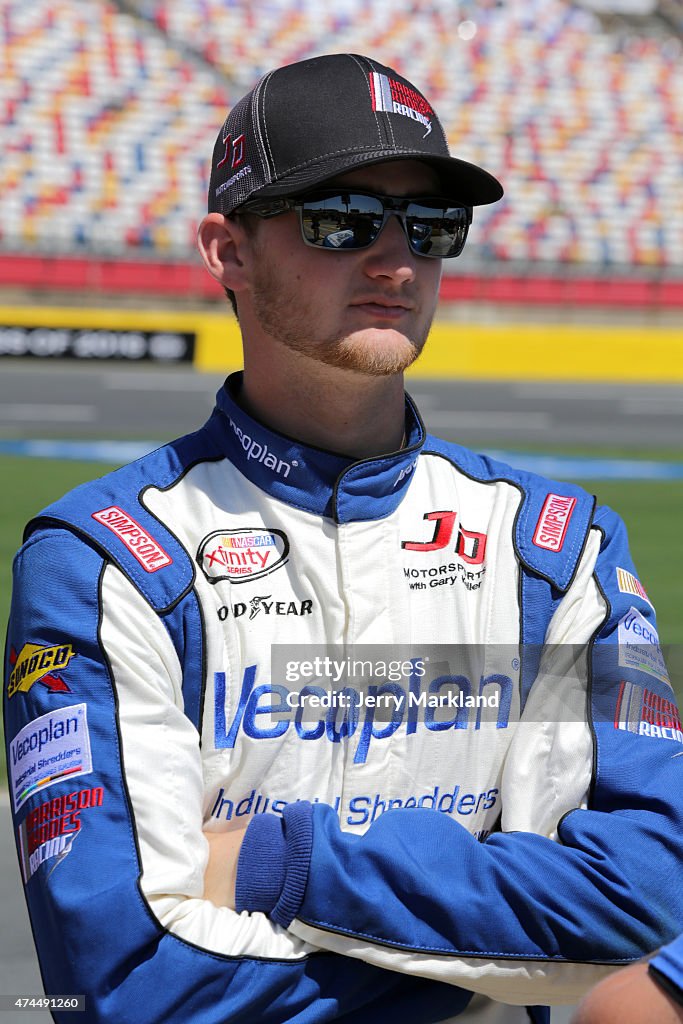 Harrison Rhodes Racing Harrison Rhodes, driver of the Vecoplan Chevrolet, stands on the grid ...