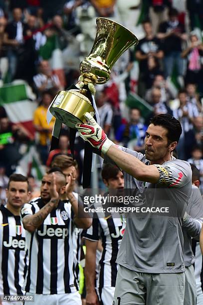 Juventus' goalkeeper and captain Gianluigi Buffon holds the Cup as players present the Tim Cup trophy to their fans prior the Italian Serie A...