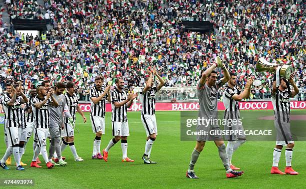 Juventus players present the Tim Cup trophy to their fans prior the Italian Serie A football match Juventus vs Napoli on May 23, 2015 at the Juventus...