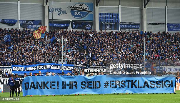 The players of SC Paderborn 07 hold a banner thanking the fans after the Bundesliga match between SC Paderborn 07 and VfB Stuttgart at Benteler Arena...