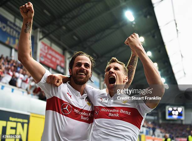 Florian Klein and Martin Harnik of Stuttgart celebrate staying in the first Bundesliga after winning the Bundesliga match between SC Paderborn 07 and...