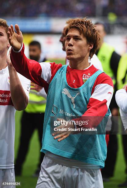 Gotoku Sakai of Stuttgart celebrates staying in the first Bundesliga after winning the Bundesliga match between SC Paderborn 07 and VfB Stuttgart at...