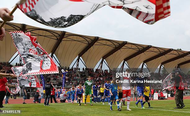 Erfurt and SpVgg Unterhaching walk onto the field during the Third League match between FC Rot Weiss Erfurt and SpVgg Unterhaching at...