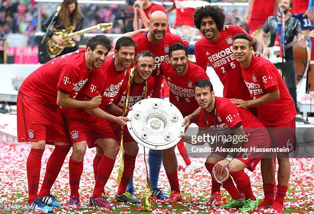 Bayern Muenchen players celebrate with the trophy after winning the league during the Bundesliga match between FC Bayern Muenchen and 1. FSV Mainz 05...