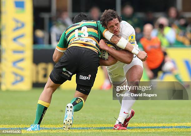 Jacques Burger of Saracens is tackled by George Pisi during the Aviva Premiership play off semi final match between Northampton Saints and Saracens...