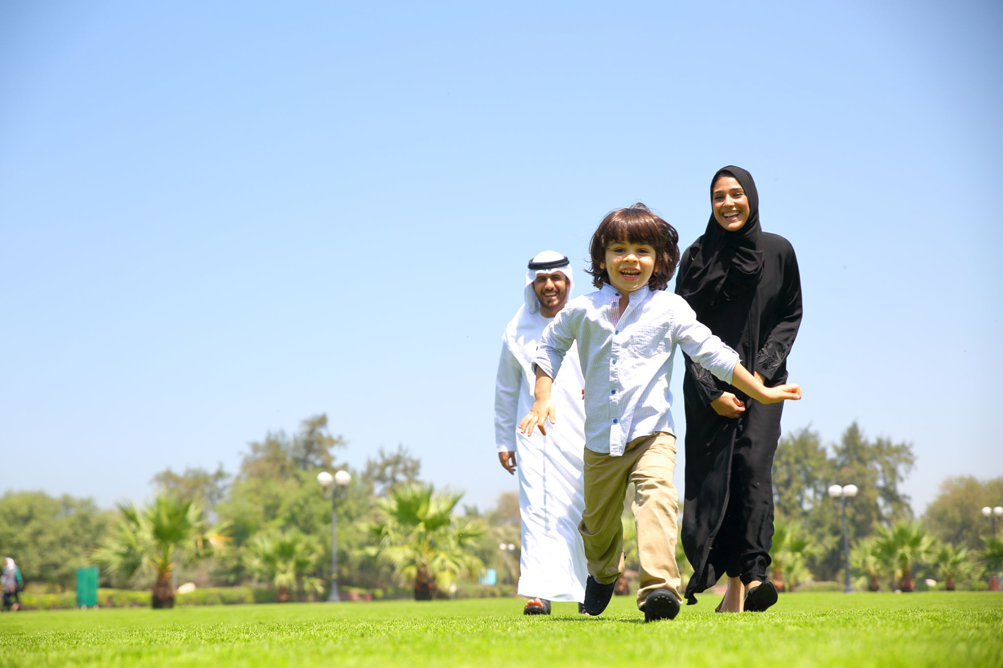 Arab Emirati family outdoors in park Arab Emirati family outdoors in park