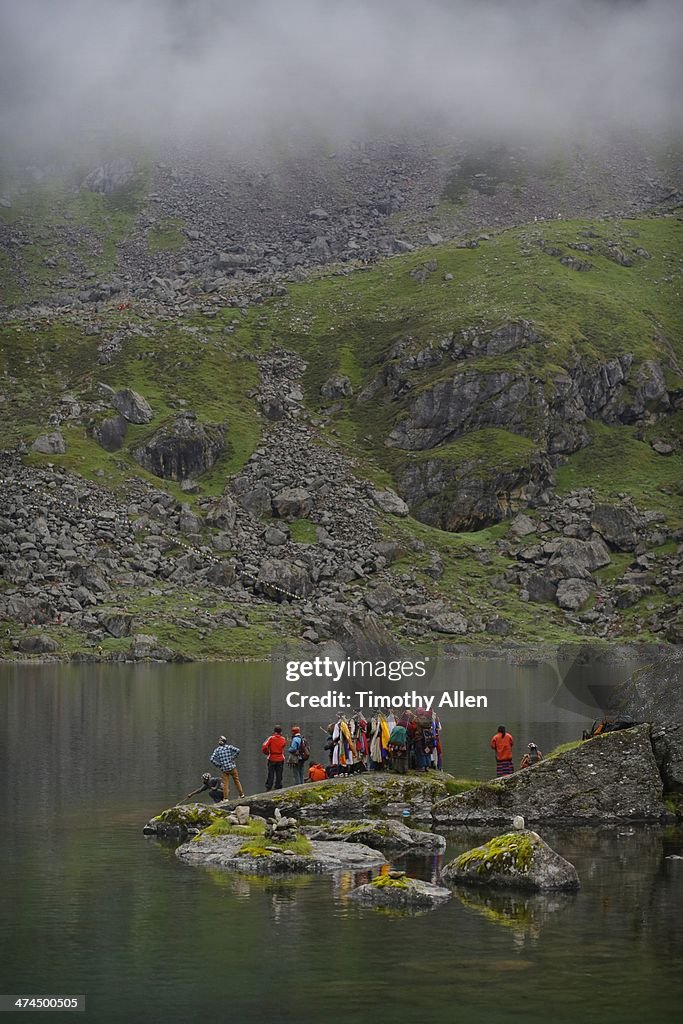 Shaman ritual at misty Gosaikunda Lake, Nepal