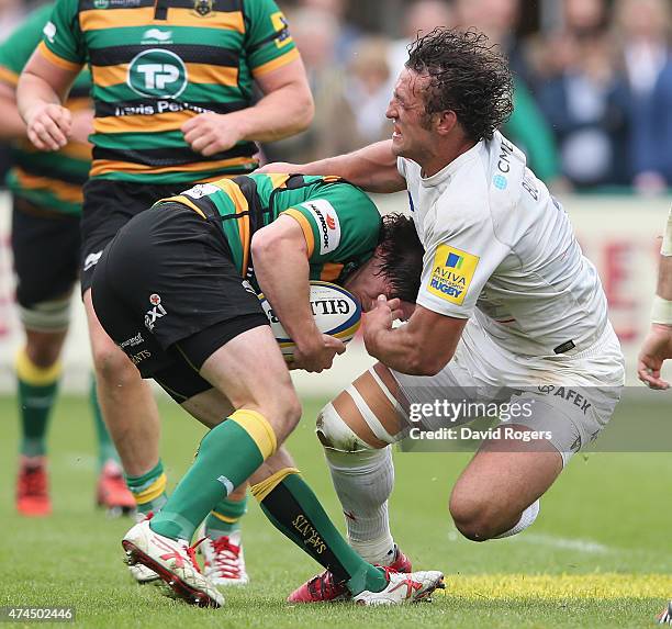 Jacques Burger of Saracens tackles Jamie Elliott during the Aviva Premiership play off semi final match between Northampton Saints and Saracens at...