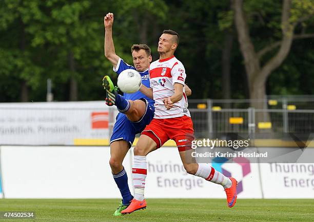 Andreas Wiegel of Erfurt is challenged by Benjamin Schwarz of Unterhaching during the Third League match between FC Rot Weiss Erfurt and SpVgg...