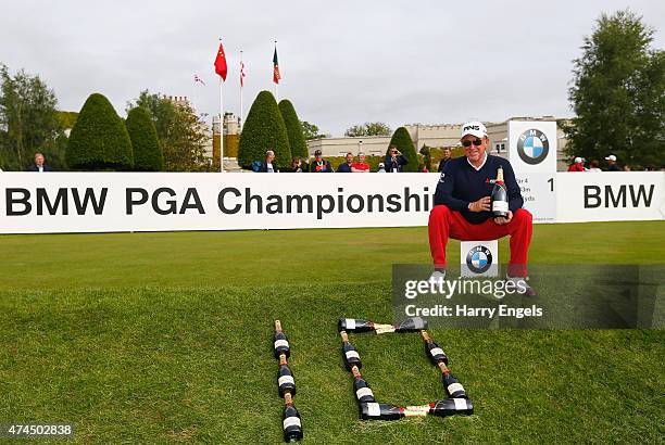Miguel Angel Jimenez of Spain celebrates after his record tenth hole-in-one on the European Tour during day 3 of the BMW PGA Championship at...