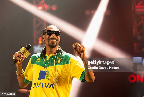 Snoop Dogg performs on stage, wearing a Norwich City F.C. Football shirt, during day one of BBC Radio 1's Big Weekend at Earlham Park on May 23, 2015...