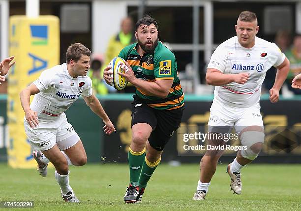 Alex Corbisiero of Northampton breaks with th eball during the Aviva Premiership play off semi final match between Northampton Saints and Saracens at...