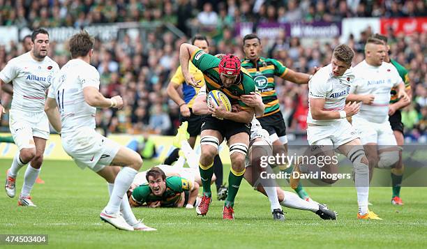 Christian Day of Northampton is tackled during the Aviva Premiership play off semi final match between Northampton Saints and Saracens at Franklin's...