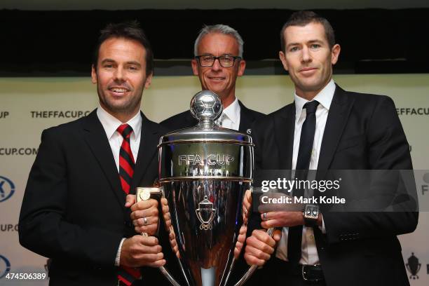 Paul Reid of the Rockdale City Suns, FFA CEO David Gallop and former Socceroos Brett Emerton pose with the FFA Cup trophy during the FFA Cup launch...