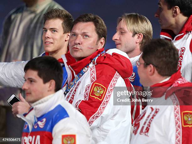 Bronze medalist Nikita Katsalapov and gold medalist Evgeni Plushenko of Russia enter the stadium during the 2014 Sochi Winter Olympics Closing...