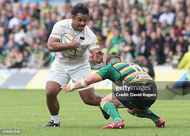 Billy Vunipola of Saracens is tackled by Alex Waller during the Aviva Premiership play off semi final match between Northampton Saints and Saracens...