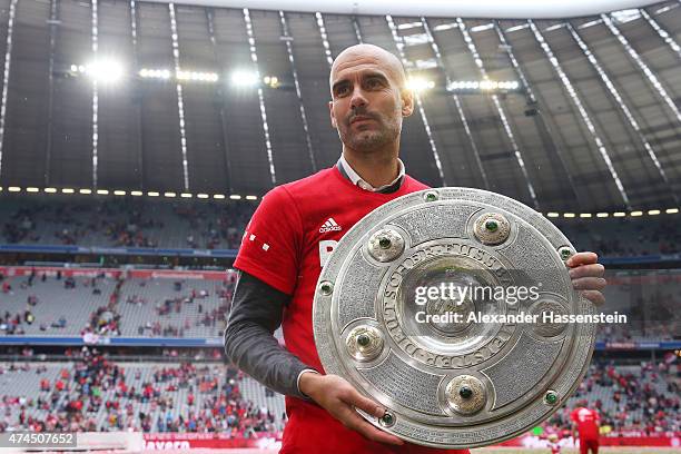 Josep Guardiola the head coach of Bayern Muenchen celebrates after winning the league during the Bundesliga match between FC Bayern Muenchen and 1....
