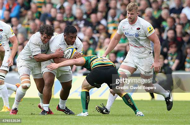 Jacques Burger and Mako Vunipola of Saracens combine to control the ball during the Aviva Premiership play off semi final match between Northampton...
