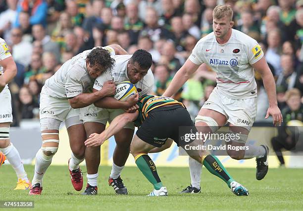 Jacques Burger and Mako Vunipola of Saracens combine to control the ball during the Aviva Premiership play off semi final match between Northampton...