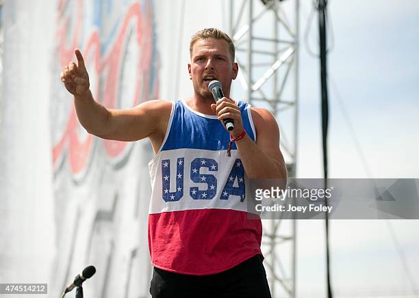 Football player Pat McAfee of the Indianapolis Colts introduces the rock band O.A.R. At the Coors Light Carb Day 2015 during the 2015 Indy 500...