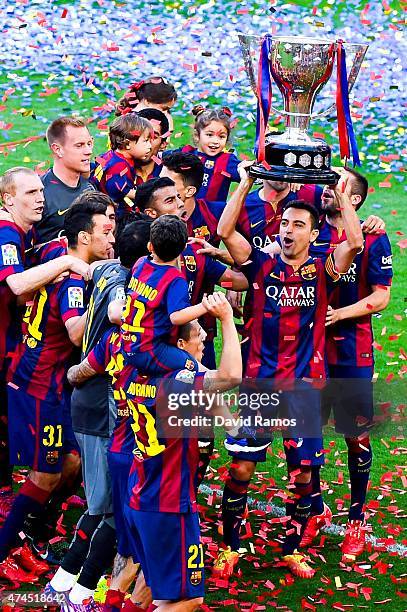 Barcelona players celebrate with La Liga trophy at the end of the La Liga match between FC Barcelona and RC Deportivo de la Coruna at Camp Nou on May...